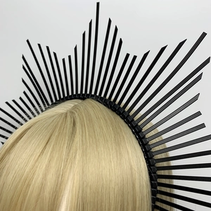 Close-up of black zip tie halo crown headband on a golden mannequin display head