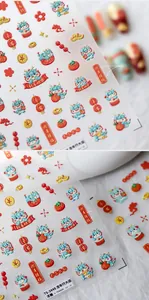 Macro view of 3D embossed New Year nail stickers featuring cartoon dragons and lanterns