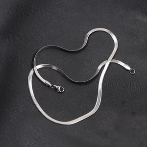 Detailed close-up of 4mm silver flat snake chain necklace with lobster clasp