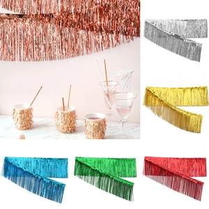 Metallic tinsel foil fringe curtains in gold and rose gold for party backdrop decoration
