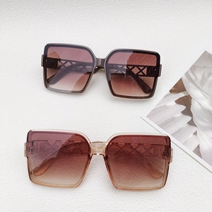 Macro shot of oversized square sunglasses featuring hollow geometric mesh temple design