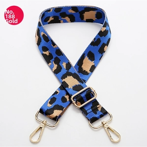 Detail of adjustable leopard print bag strap in blue with golden lobster clasps