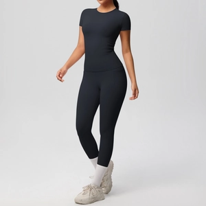 Detailed view of black high-elastic yoga set with slim fit top and high waist leggings