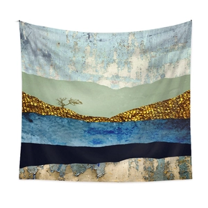 Close-up of abstract mountain landscape tapestry with gold texture and navy patterns