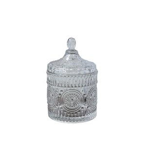Nordic glass storage jar with sunflower embossed patterns and beaded lid on white background