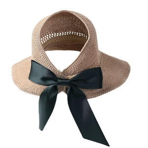 Women's summer straw visor with large black bow for UV protection and beach wear