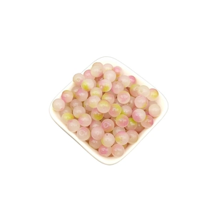 Detailed top view of 8mm pink and green gradient glass beads for DIY jewelry making
