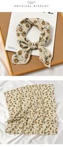 Detail of floral linen silk scarf with tulip pattern and fine stitched edges