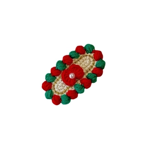 Handmade crochet strawberry hair clip with pearls and gold trim for Christmas styling