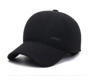 Detail of the sport leather badge on black wool winter baseball cap for older men