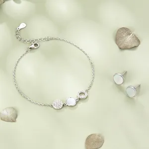 S925 silver jewelry set with circular mother of pearl earrings and bracelet with pavé stones
