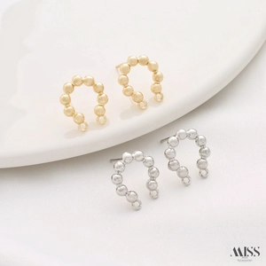 Detail view of 14K gold plated C-ring earring connectors with double hanging loops