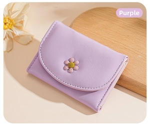 Detail of lavender trifold wallet with a 3D daisy flower and precise stitching decor