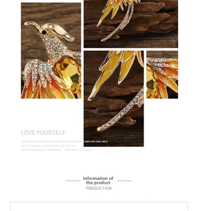Detailed view of phoenix brooch featuring orange gradient enamel and sparkling rhinestones