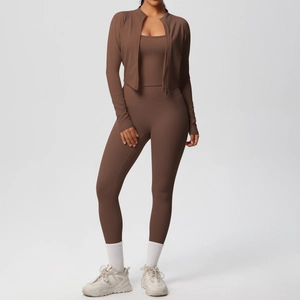 Three-piece chocolate brown yoga set with zip-up jacket, sports bra, and high-waist leggings