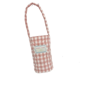 Pink gingham quilted water bottle carrier bag with a soft handle and logo patch