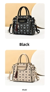 Detail view of stylish tote bags in black and khaki with cat pendant and gold branding