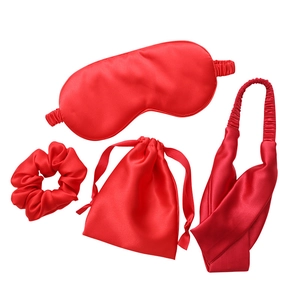 Four-piece red faux silk sleep set including eye mask, scrunchie, headband, and pouch