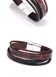 Detailed view of multilayer leather bracelet with cross pattern and silver magnetic clasp