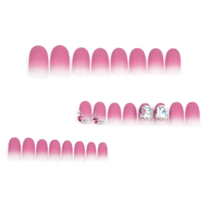 Pink and white gradient press-on nails set with rhinestones and heart gems decorations