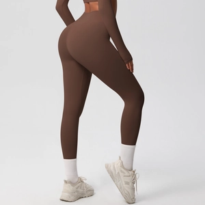 Detail view of high-waisted chocolate brown yoga leggings with butt-lifting effect