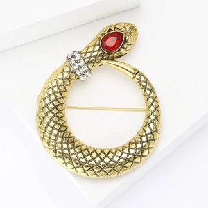 Elegant gold snake brooch with red gemstone head and sparkling rhinestone neck detail