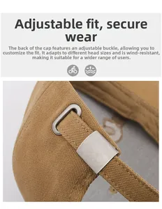 Detailed macro view of the adjustable metal buckle on khaki cotton baseball cap