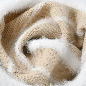 Plush beige and white striped knitted beanie hat featuring soft faux mohair texture