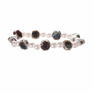 Handmade beaded bracelet with white pearls and multicolored ceramic floral charms