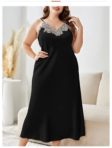 Detail of elegant black satin nightgown with V-neckline and grey lace floral embroidery