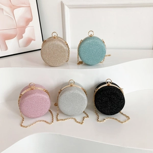 Sparkly spherical evening clutches in five colors with metal frame and chain strap