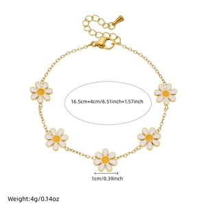 Daisy flower charm bracelet in gold and white with size measurements on white background