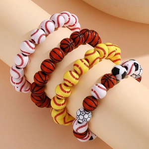 Detail showing four styles of adjustable sports ball beaded bracelets on a display stand
