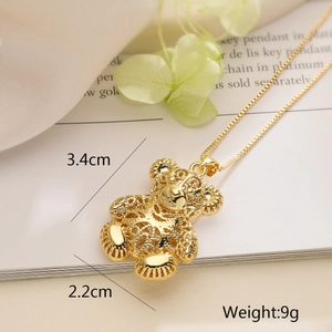 Detailed view of hollow bear pendant with 3.4cm height and 2.2cm width on gold chain
