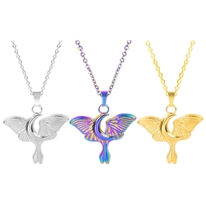 Macro view of moon and moth wing pendants in gold, silver, and iridescent finishes
