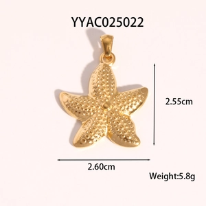 Golden starfish pendant detail showing 2.55cm height and 2.60cm width dimensions