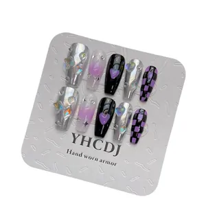 Handmade press-on nails in black and purple checkerboard with chrome heart and star details