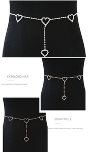 Macro detail of rhinestone body chains featuring heart pendants on black model torso