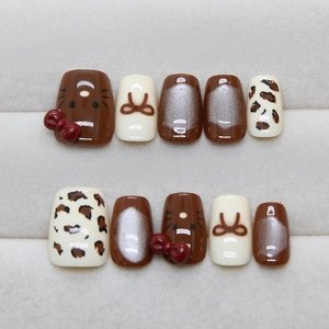 Cat-eye cat-themed caramel press-on nails with 3D bows and leopard pattern