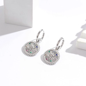 Bohemian silver earrings with sunburst pendants and colorful zircon stones on geometric blocks