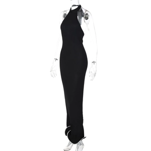 Detail of black halter maxi dress showing slim fit cut and ribbed texture fabric