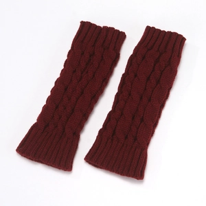 Detailed view of wine red cable knit leg warmers with ribbed edges and soft texture