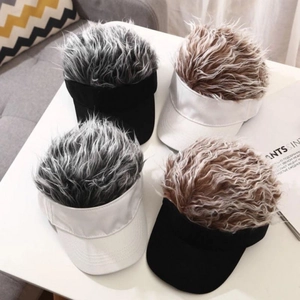 Detailed overhead view of funny wig hats in grey and brown with black and white bases