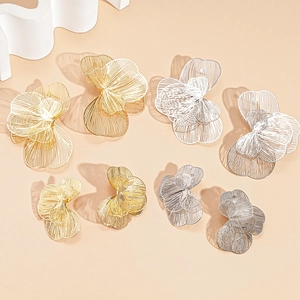 Hollow flower petal stud earrings in gold and silver metal finish, set of 4 pairs