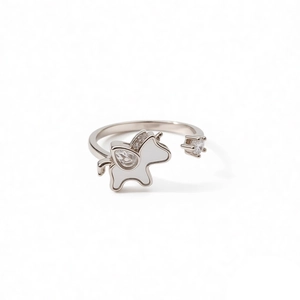 Silver unicorn ring with zircon and round pearl accent on a minimalist white background