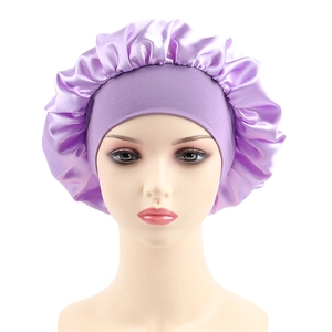 Detail of purple satin sleep bonnet showing glossy fabric texture and wide elastic headband