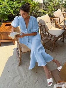 French style light blue linen two-piece set with V-neck puff sleeve top and midi skirt