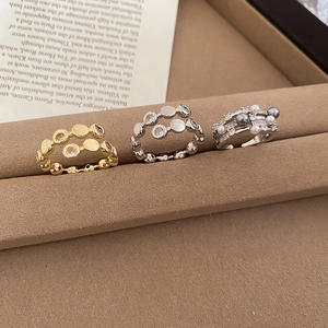 Three-layer pearl and zircon rings presented on an elegant card in a jewelry gift box