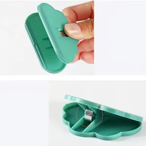 Green cloud-shaped food sealing clip with a wide opening and stainless steel spring