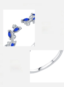 Detailed view of S925 sterling silver ring featuring marquise blue zircon leaf and hallmark